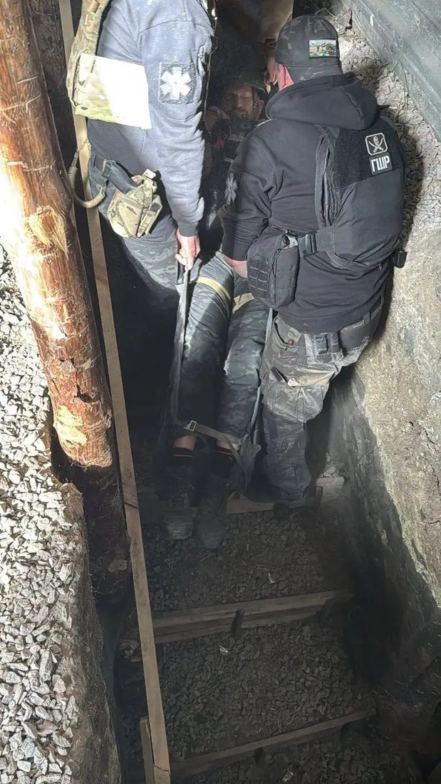 Rescuer leaning into the drag in a tight section of trench